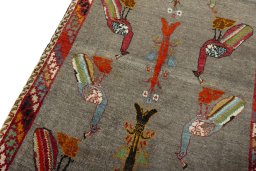 Backside of handmade 2000s Persian Gabbeh rug showing knot structure and weave density