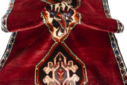 Corner detail of 2000s Persian Gabbeh rug showing border pattern and Wool pile