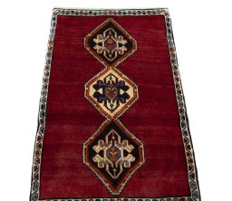 Surface texture of 2000s Persian Gabbeh rug with natural Wool and intricate pattern