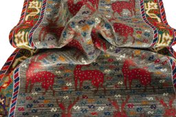 Corner detail of 2000s Persian Gabbeh rug showing border pattern and Wool pile