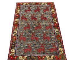 Surface texture of 2000s Persian Gabbeh rug with natural Wool and intricate pattern