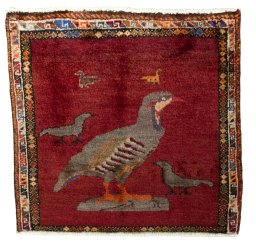 Full view of 1970s Persian Gabbeh rug from Iran / Persia, 56 × 59 cm in Red tones