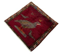 Corner detail of 1970s Persian Gabbeh rug showing border pattern and Wool pile