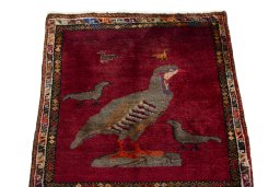 Surface texture of 1970s Persian Gabbeh rug with natural Wool and intricate pattern