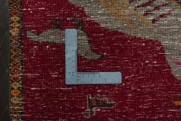 Backside of handmade 1970s Persian Gabbeh rug showing knot structure and weave density