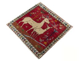 Corner detail of 1970s Persian Gabbeh rug showing border pattern and Wool pile