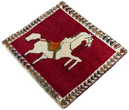 Corner detail of 1970s Persian Gabbeh rug showing border pattern and Wool pile