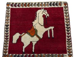 Surface texture of 1970s Persian Gabbeh rug with natural Wool and intricate pattern