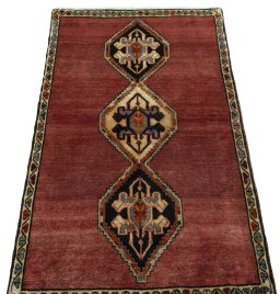Surface texture of 2000s Persian Gabbeh rug with natural Wool and intricate pattern