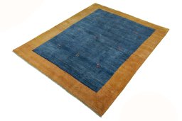 Corner detail of New Persian Gabbeh rug showing border pattern and Wool pile