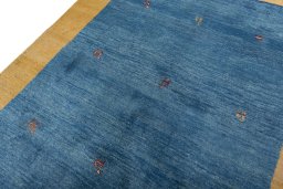 Backside of handmade New Persian Gabbeh rug showing knot structure and weave density