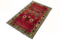 Corner detail of 2000s Persian Gabbeh rug showing border pattern and Wool pile