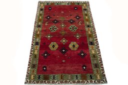 Surface texture of 2000s Persian Gabbeh rug with natural Wool and intricate pattern