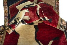 Corner detail of 2000s Persian Gabbeh rug showing border pattern and Wool pile