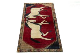 Surface texture of 2000s Persian Gabbeh rug with natural Wool and intricate pattern