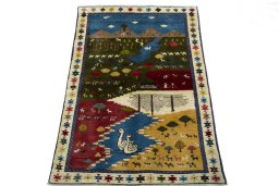 Surface texture of 2000s Persian Gabbeh rug with natural Wool and intricate pattern