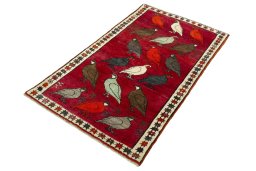 Corner detail of 2000s Persian Gabbeh rug showing border pattern and Wool pile