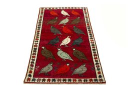 Surface texture of 2000s Persian Gabbeh rug with natural Wool and intricate pattern