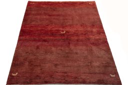 Surface texture of 2000s Persian Gabbeh rug with natural Wool and intricate pattern