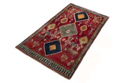 Corner detail of 2000s Persian Gabbeh rug showing border pattern and Wool pile