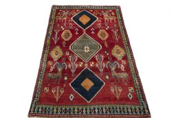 Surface texture of 2000s Persian Gabbeh rug with natural Wool and intricate pattern