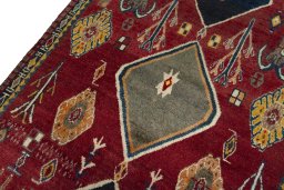 Backside of handmade 2000s Persian Gabbeh rug showing knot structure and weave density