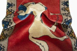 Corner detail of 2000s Persian Gabbeh rug showing border pattern and Wool pile