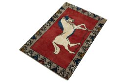 Corner detail of 2000s Persian Gabbeh rug showing border pattern and Wool pile