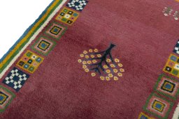 Backside of handmade New Persian Gabbeh rug showing knot structure and weave density