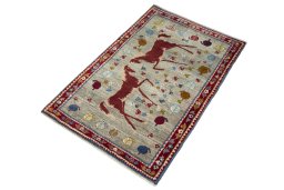 Corner detail of 2000s Persian Gabbeh rug showing border pattern and Wool pile