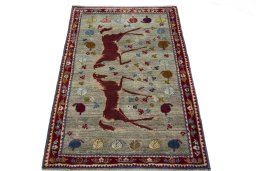 Surface texture of 2000s Persian Gabbeh rug with natural Wool and intricate pattern