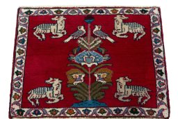 Surface texture of 2000s Persian Gabbeh rug with natural Wool and intricate pattern