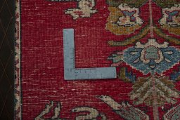 Backside of handmade 2000s Persian Gabbeh rug showing knot structure and weave density