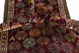 Corner detail of 2000s Persian Gabbeh rug showing border pattern and Wool pile