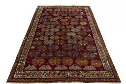 Surface texture of 2000s Persian Gabbeh rug with natural Wool and intricate pattern