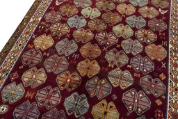 Backside of handmade 2000s Persian Gabbeh rug showing knot structure and weave density