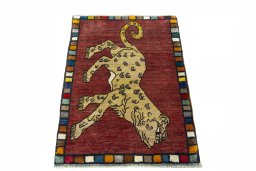Surface texture of 2000s Persian Gabbeh rug with natural Wool and intricate pattern