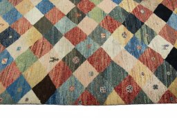 Close-up detail of 2000s Persian Gabbeh rug from Iran / Persia showing Wool weave