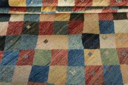 Full view of 2000s Persian Gabbeh rug from Iran / Persia, 224 × 198 cm in Multi Color tones