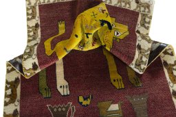 Corner detail of 2000s Persian Gabbeh rug showing border pattern and Wool pile
