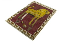 Corner detail of 2000s Persian Gabbeh rug showing border pattern and Wool pile