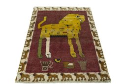 Surface texture of 2000s Persian Gabbeh rug with natural Wool and intricate pattern
