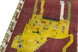 Backside of handmade 2000s Persian Gabbeh rug showing knot structure and weave density
