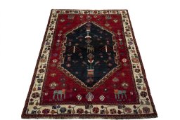 Surface texture of 2000s Persian Gabbeh rug with natural Wool and intricate pattern