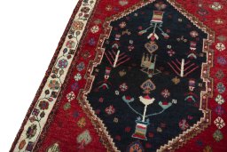 Backside of handmade 2000s Persian Gabbeh rug showing knot structure and weave density