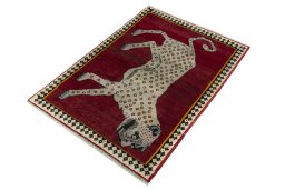 Corner detail of 2000s Persian Gabbeh rug showing border pattern and Wool pile