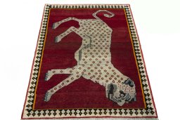 Surface texture of 2000s Persian Gabbeh rug with natural Wool and intricate pattern