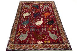 Surface texture of 2000s Persian Gabbeh rug with natural Wool and intricate pattern