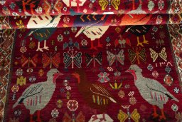 Full view of 2000s Persian Gabbeh rug from Iran / Persia, 200 × 129 cm in Red tones