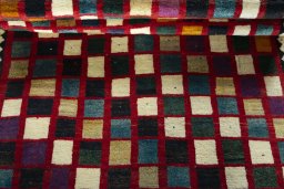 Full view of 2000s Persian Gabbeh rug from Iran / Persia, 189 × 127 cm in Multi Color tones